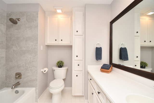 full bathroom featuring tile floors, tiled shower / bath combo, vanity, and toilet