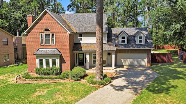 view of front of home featuring a garage and a front yard