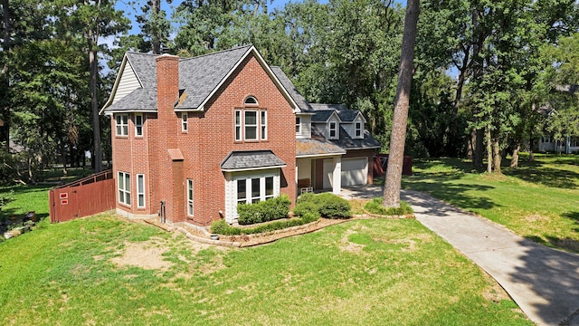 view of front of property featuring a garage and a front yard