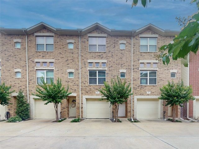 multi unit property featuring a garage