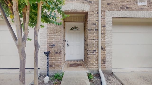 entrance to property featuring a garage