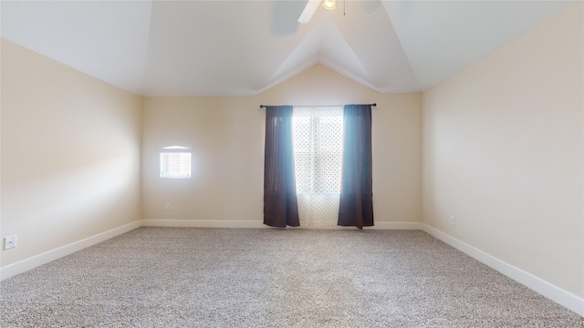 carpeted empty room with lofted ceiling and ceiling fan