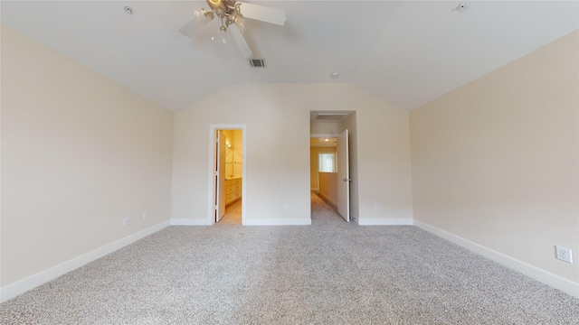 unfurnished bedroom with light carpet, lofted ceiling, connected bathroom, and ceiling fan