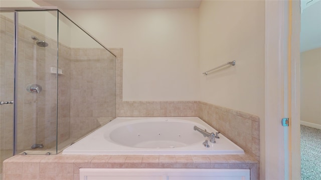 bathroom with shower with separate bathtub