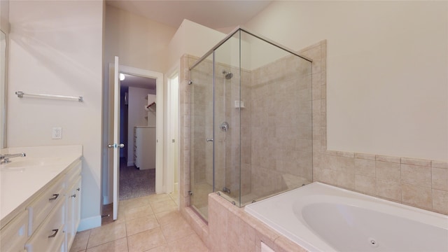 bathroom with vanity, tile flooring, and plus walk in shower