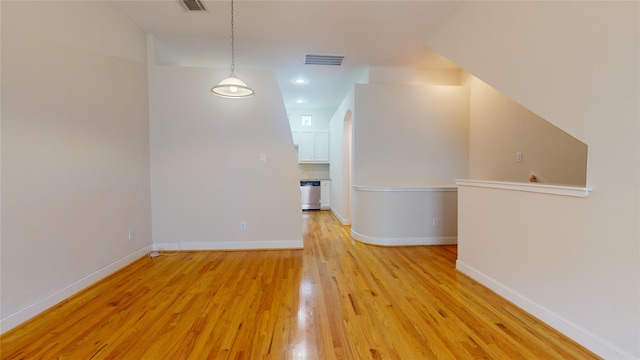 additional living space featuring light hardwood / wood-style flooring