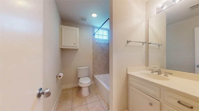 full bathroom with tiled shower / bath, tile flooring, toilet, and vanity