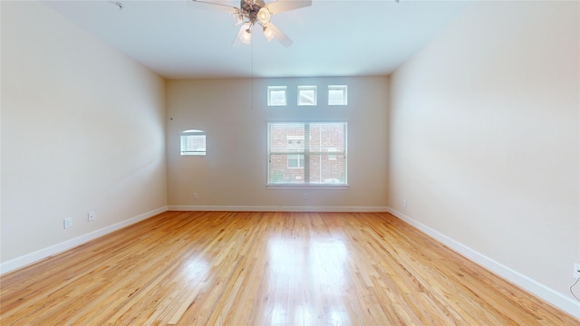 unfurnished room with ceiling fan and light hardwood / wood-style flooring