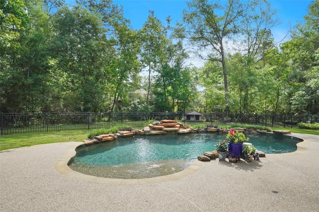 view of swimming pool with a patio