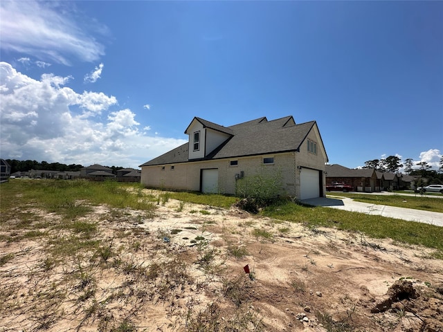 view of property exterior with a garage