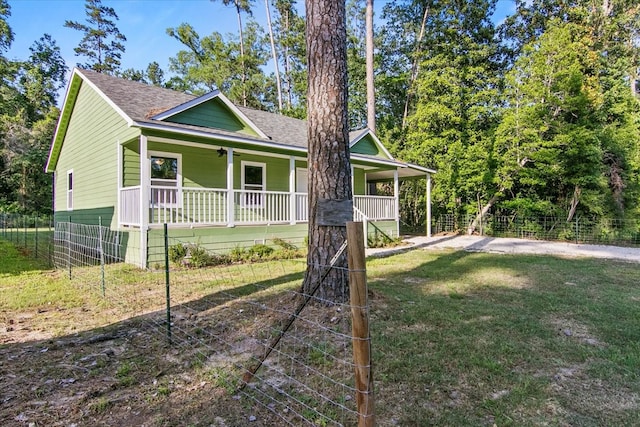 view of front of house with a front lawn and a porch