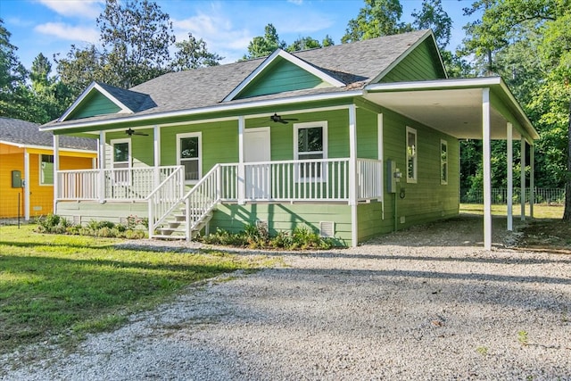 view of front of home featuring a carport and covered porch