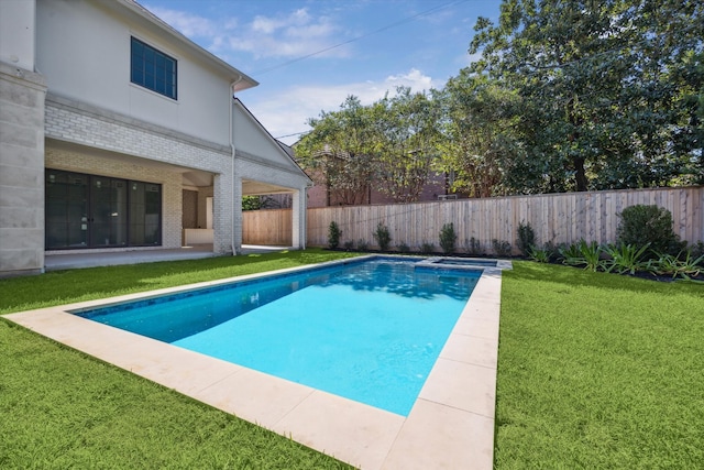 view of swimming pool with a yard and a patio area