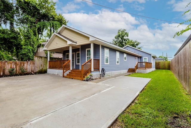 view of front facade with a front yard and a porch