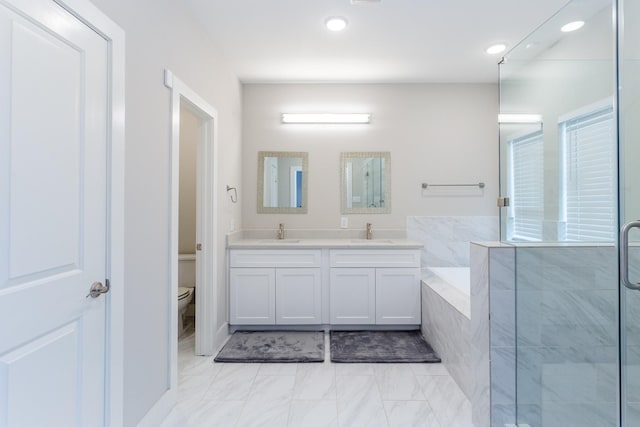 full bathroom with dual sinks, vanity with extensive cabinet space, plus walk in shower, tile floors, and toilet