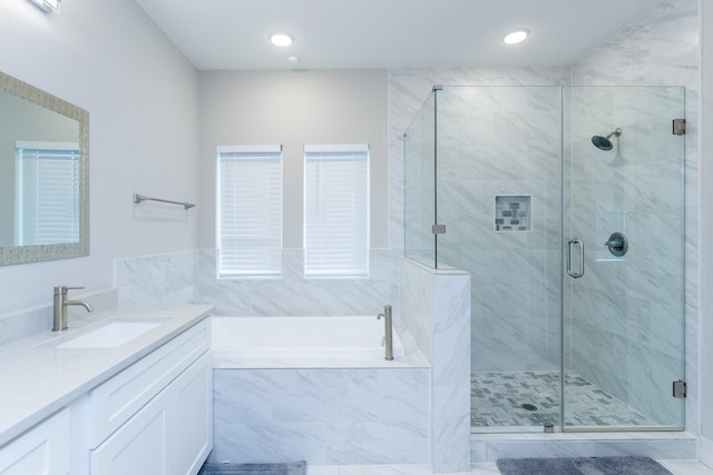 bathroom with plus walk in shower and vanity