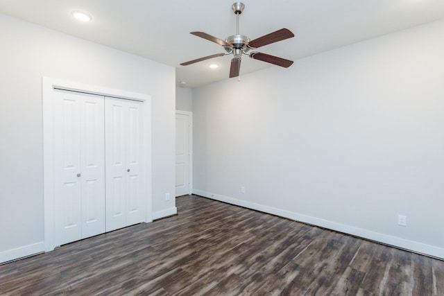 unfurnished bedroom featuring a closet, ceiling fan, and dark hardwood / wood-style floors