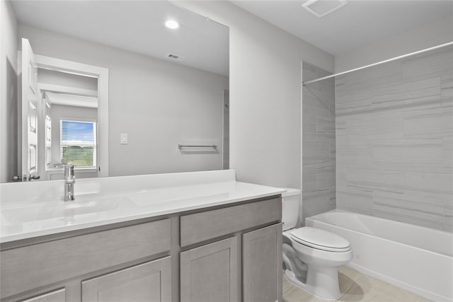 full bathroom with vanity, toilet, and tiled shower / bath combo