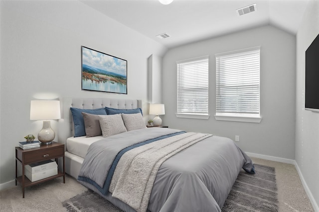 carpeted bedroom featuring vaulted ceiling