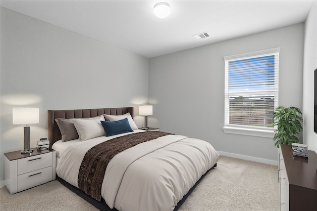 bedroom with light carpet