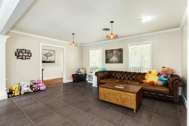 tiled living room with crown molding and ornate columns