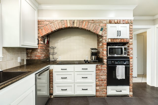 kitchen with crown molding, black appliances, backsplash, dark tile flooring, and white cabinetry