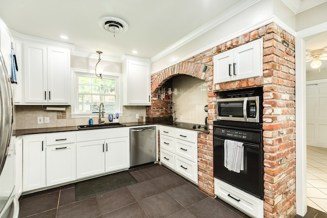 kitchen featuring tasteful backsplash, white cabinetry, black appliances, sink, and dark tile floors