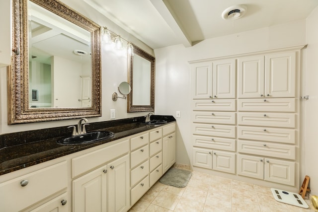 bathroom featuring tile floors and double sink vanity