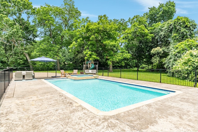 view of swimming pool with a patio