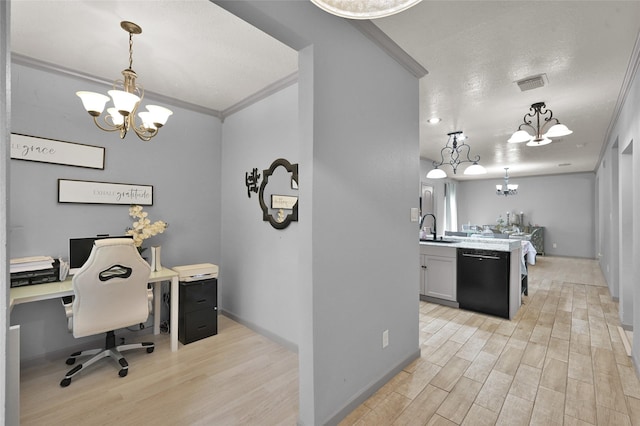 office featuring light wood-type flooring, sink, crown molding, and a chandelier