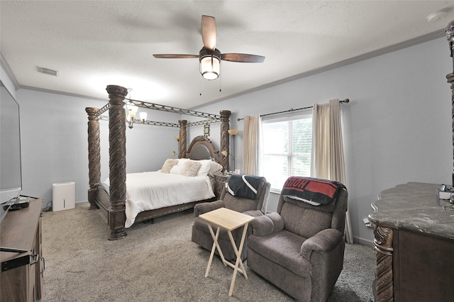 carpeted bedroom featuring ceiling fan, ornamental molding, and a textured ceiling