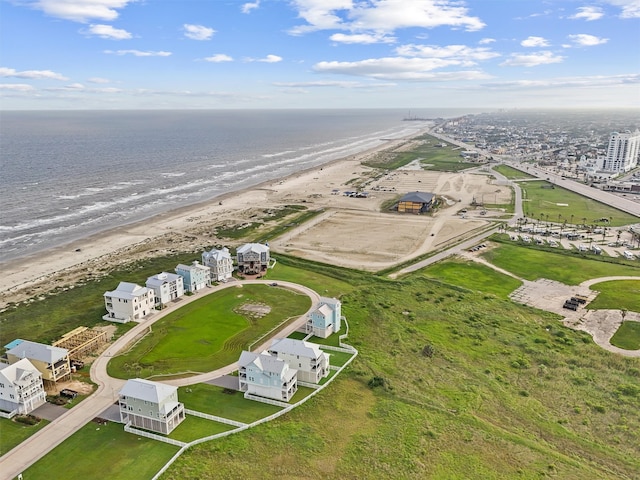 bird's eye view with a water view and a view of the beach