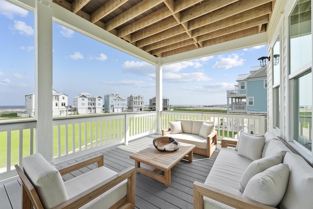 wooden terrace featuring an outdoor hangout area