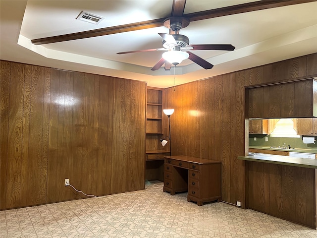 unfurnished office with sink, light tile flooring, and ceiling fan