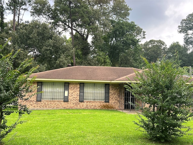 ranch-style house with a front lawn