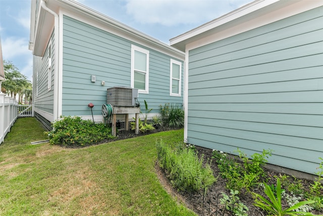 rear view of house featuring a yard