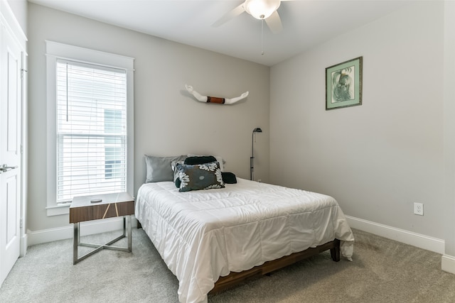 carpeted bedroom featuring ceiling fan