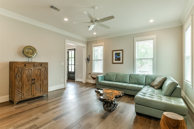 living room featuring crown molding, ceiling fan, and hardwood / wood-style floors