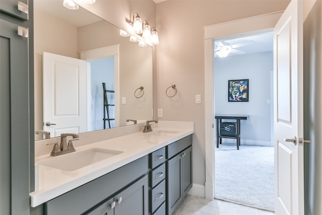 bathroom featuring tile floors, dual sinks, ceiling fan, and oversized vanity