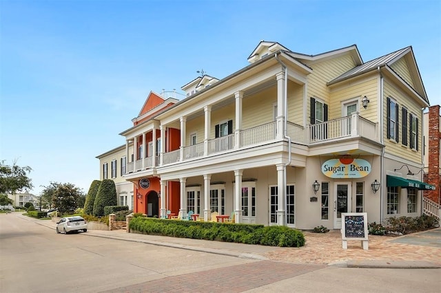 view of front of home with a balcony