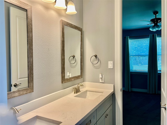 bathroom with ceiling fan and vanity