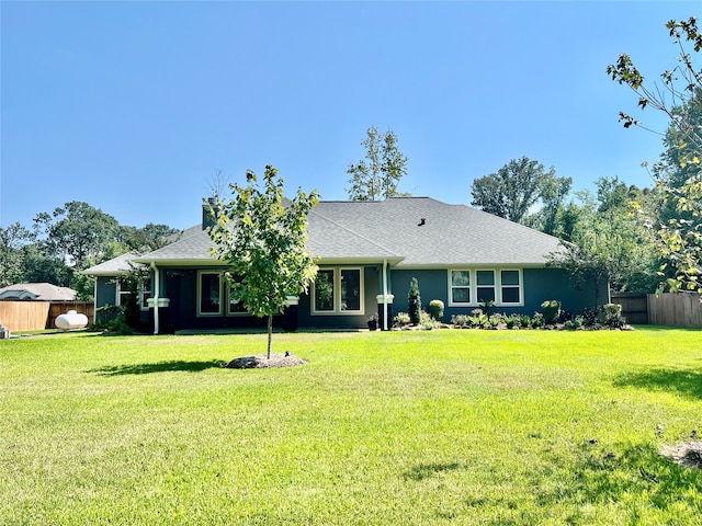 single story home featuring a front yard