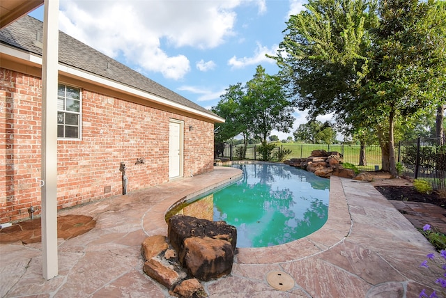 view of swimming pool with a patio area