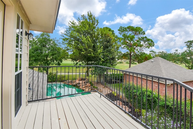 deck with a fenced in pool