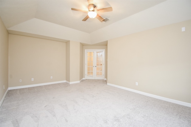 spare room featuring ceiling fan and light colored carpet