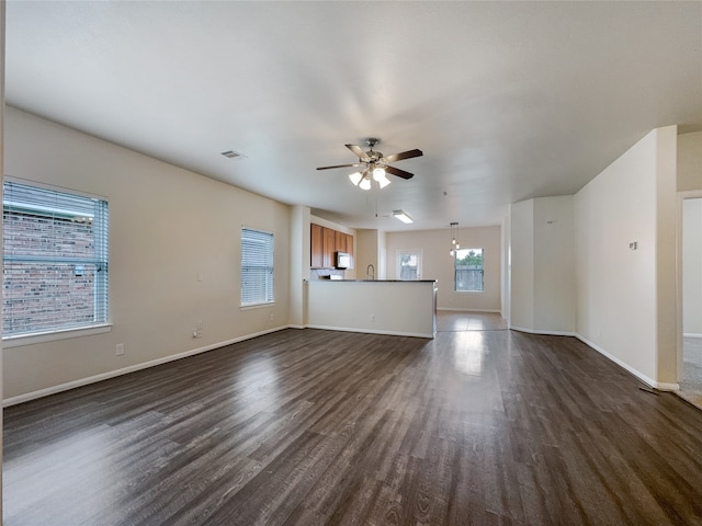 interior space featuring ceiling fan, dark hardwood / wood-style flooring, and sink