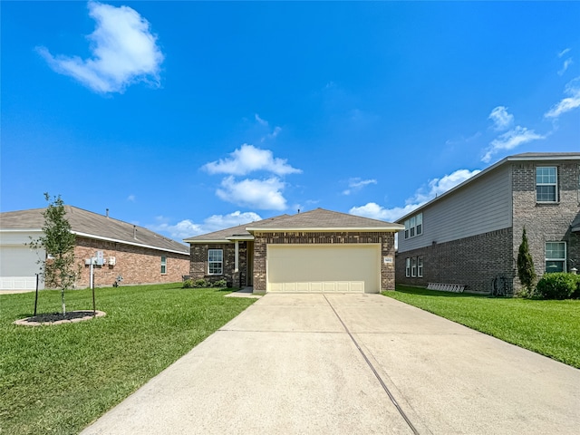 view of front of house with a garage and a front yard