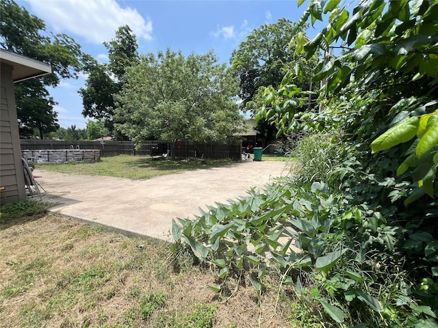 view of yard featuring a patio area and fence