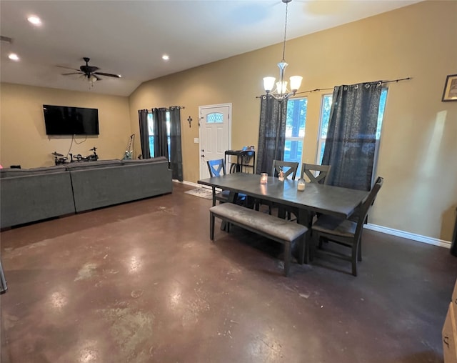 dining space with ceiling fan with notable chandelier