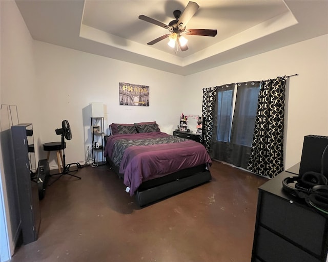 bedroom featuring a tray ceiling and ceiling fan